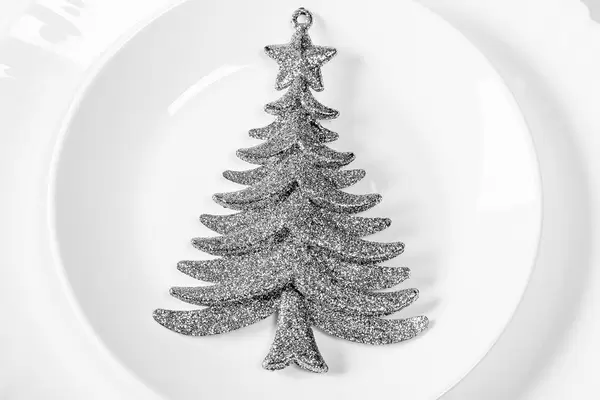 Silvery Christmas tree decor on white plate (Flip 2019)