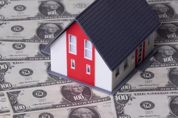 Single family house on pile of money