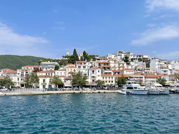 Skiathos town with houses on the sea promenade seen from the sea near the port of the Greek island