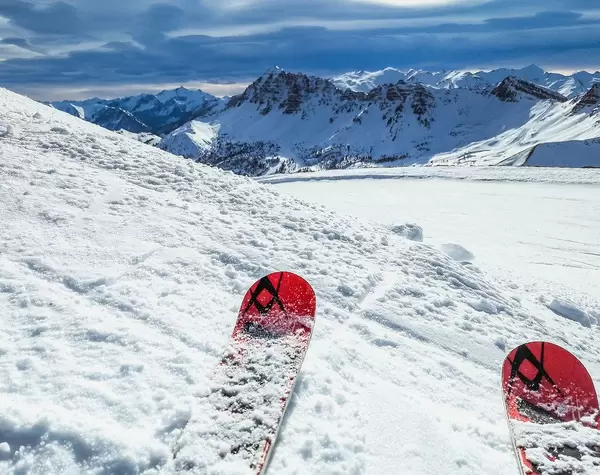 Skiing with great conditions at sunny weather with Mountains in the Background in Vars, France