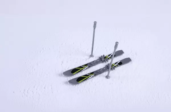 Skis with sticks on the snow