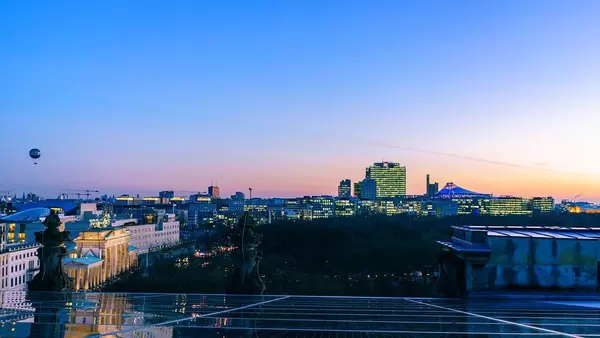 Skyline View of Berlin City at Sunset Blue Hour with Hot Air Balloon