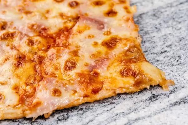 Slice of Fresh Pizza on the grey marble (Flip 2019)