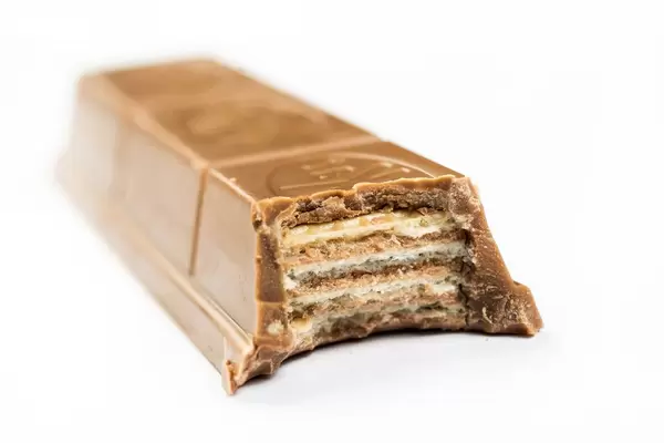 Slice of Kit Kat Chocolate Bar on the white background (Flip 2019)