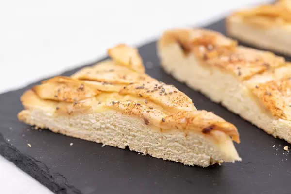 Sliced Apple Pie and served on the black stone tray