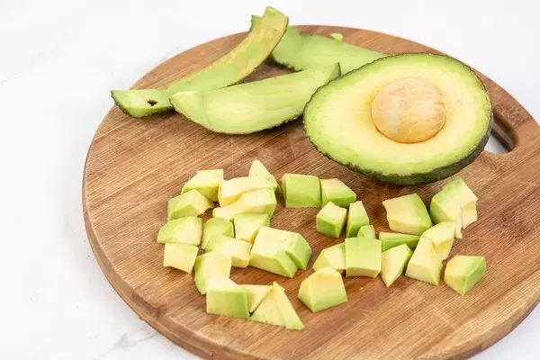 Sliced Avocado on the kitchen cutting board