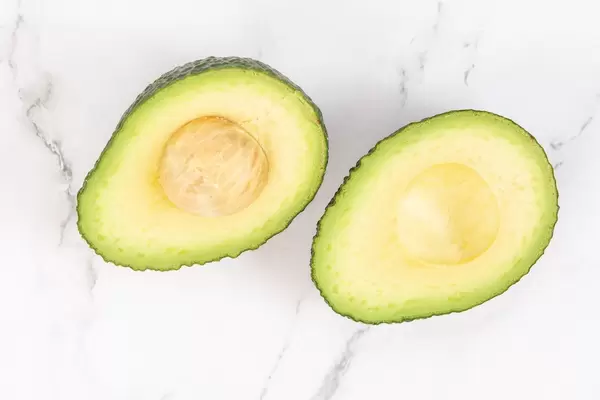 Sliced Avocado on the marble table