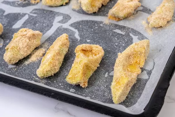 Sliced Avocado with Flour Eggs and Breadcrumbs with Paprika ready for baking (Flip 2019)