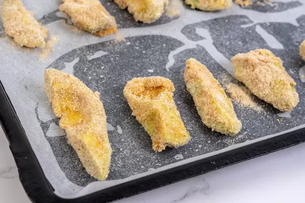 Sliced Avocado with Flour Eggs and Breadcrumbs with Paprika ready for baking