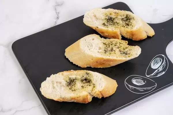 Sliced Baguettes served on the black tray