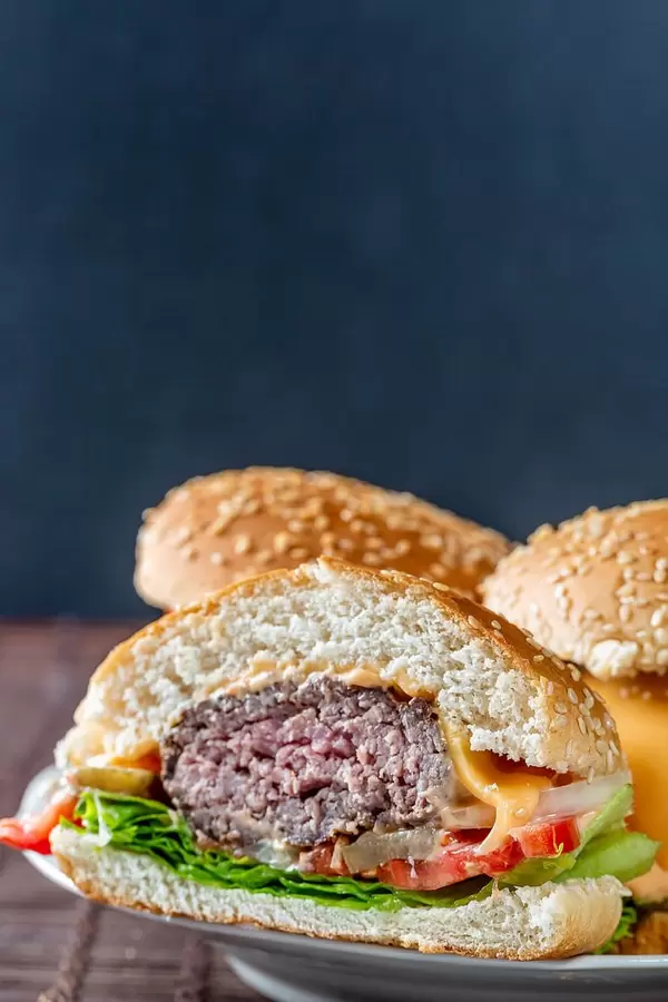 Sliced Burger on a plate with whole