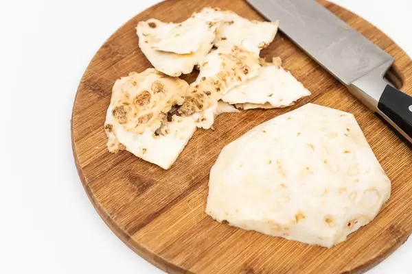 Sliced Celery Root on the wooden board
