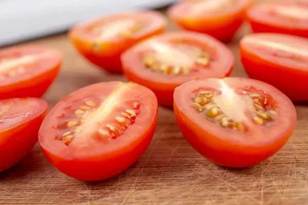 Sliced Cherry Tomatoes on the wooden board (Flip 2019)