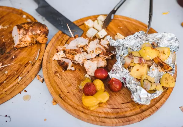 Sliced Chicken Meat With Grilled Tomatoes And Plums