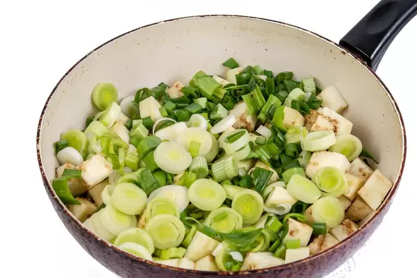 Sliced Eggplant with Leek in the frying pan