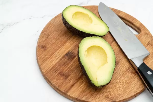 Sliced fresh Avocado on the wooden board