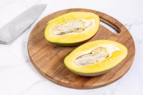 Sliced Fresh healthy Mango fruit on the wooden board