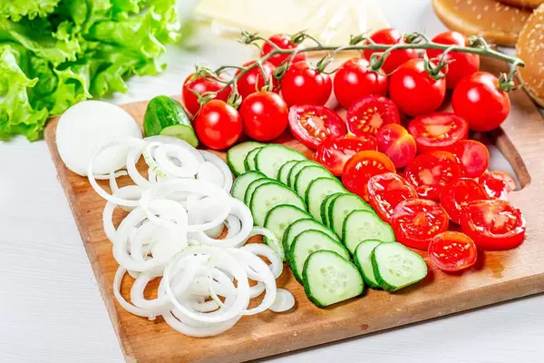 Sliced fresh ripe vegetables for making burgers (Flip 2019)
