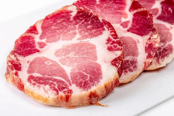 Sliced jerky pork meat on a white background (Flip 2020)