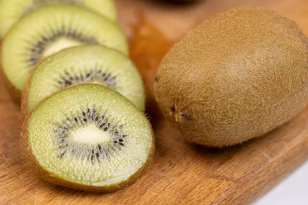 Sliced Kiwi on the wooden cutting board