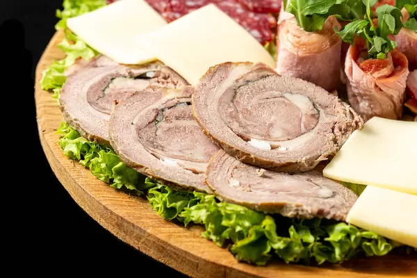 Sliced meat baked roll and cheese, close-up