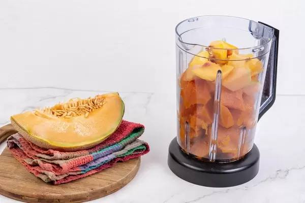 Sliced Melon in the mixer prepared for smoothie
