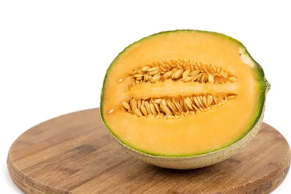 Sliced Melon on the round wooden board