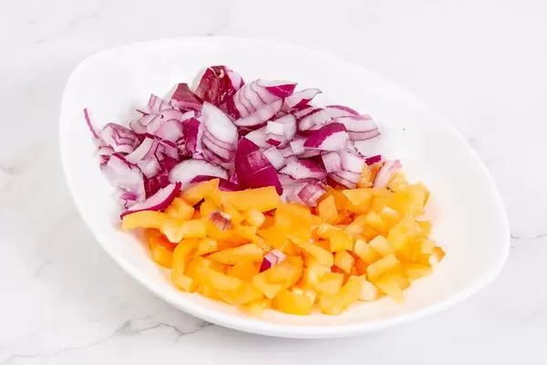 Sliced Onions and Yellow Paprika in the bowl