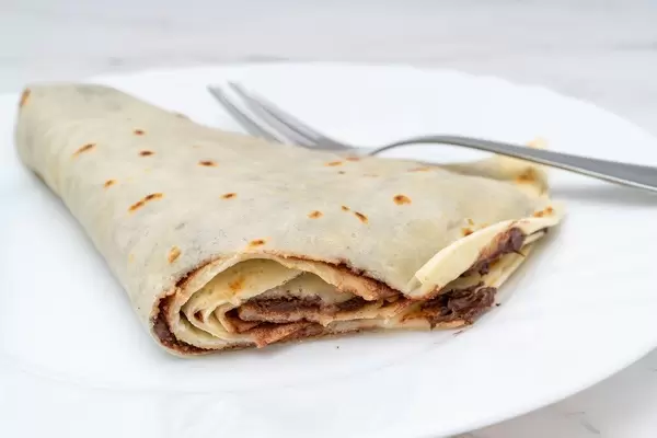 Sliced Pancake with Chocolate on the plate (Flip 2019)