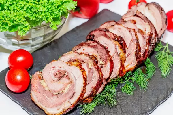 Sliced pieces of meatloaf with cherry tomatoes  Flip 2019