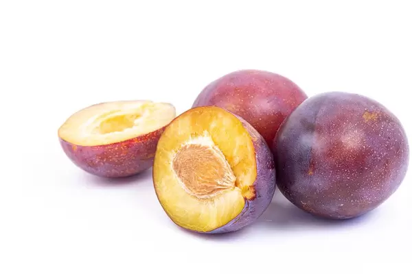 Sliced Plums isolated above white background
