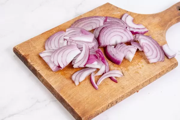 Sliced Red Onions on the wooden board