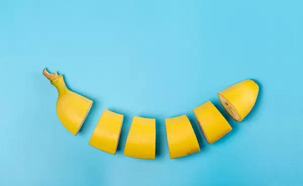Sliced ripe banana on a blue background