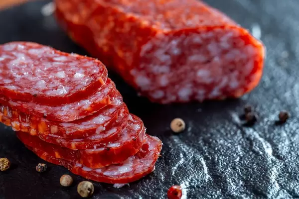 Sliced sausages on black  Flip 2019