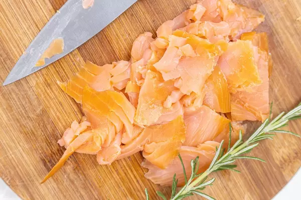 Sliced Smoked Salmon served on the wooden board