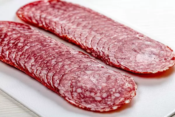 Sliced smoked sausage, close up (Flip 2019)