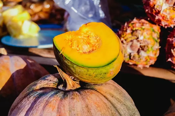Sliced squash on top of another squash