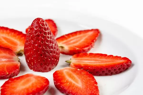 Sliced Strawberries arranged on the plate