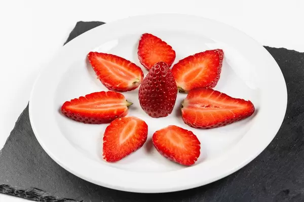 Sliced Strawberries served on the plate (Flip 2019)