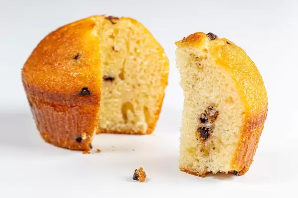 Sliced vanilla muffin with chocolate crumbs