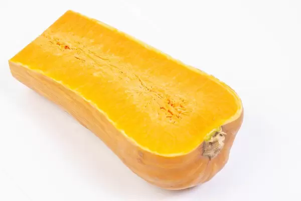 Sliced Yellow Pumpkin isolated above white background