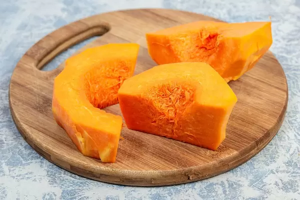 Sliced Yellow Pumpkin on the round wooden board (Flip 2019)