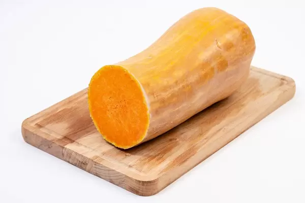 Sliced Yellow Pumpkin on the wooden board (Flip 2019)