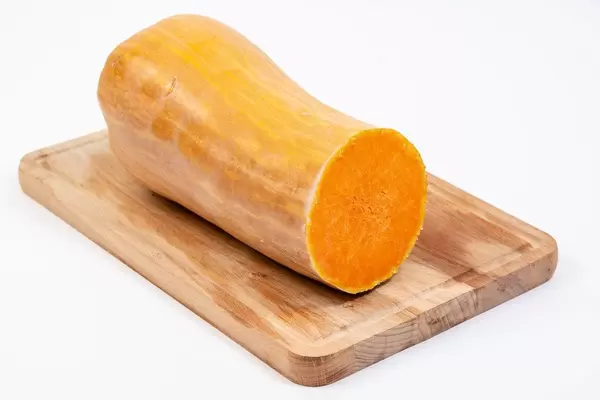 Sliced Yellow Pumpkin on the wooden board