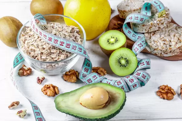 Slimming and health food products on wooden background