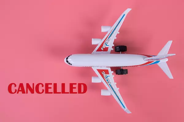 Small airplane with Candelled text on pink background