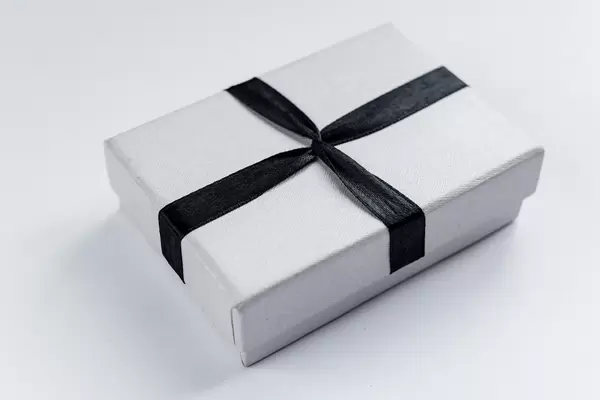 Small box tied with a black ribbon