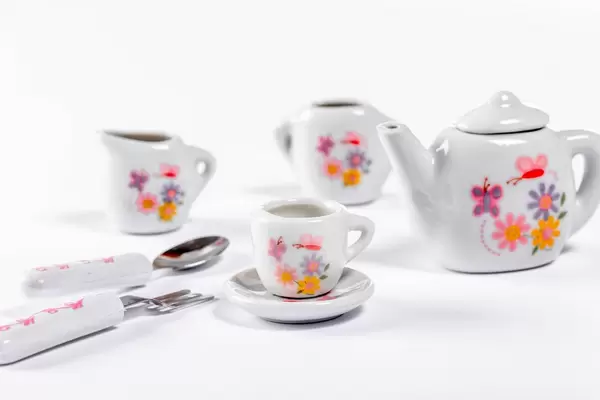 Small children ceramic tableware on white background