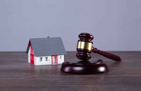 Small family house with judge gavel