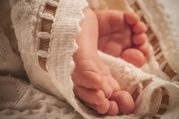 Small feet of a sleeping baby boy, close-up